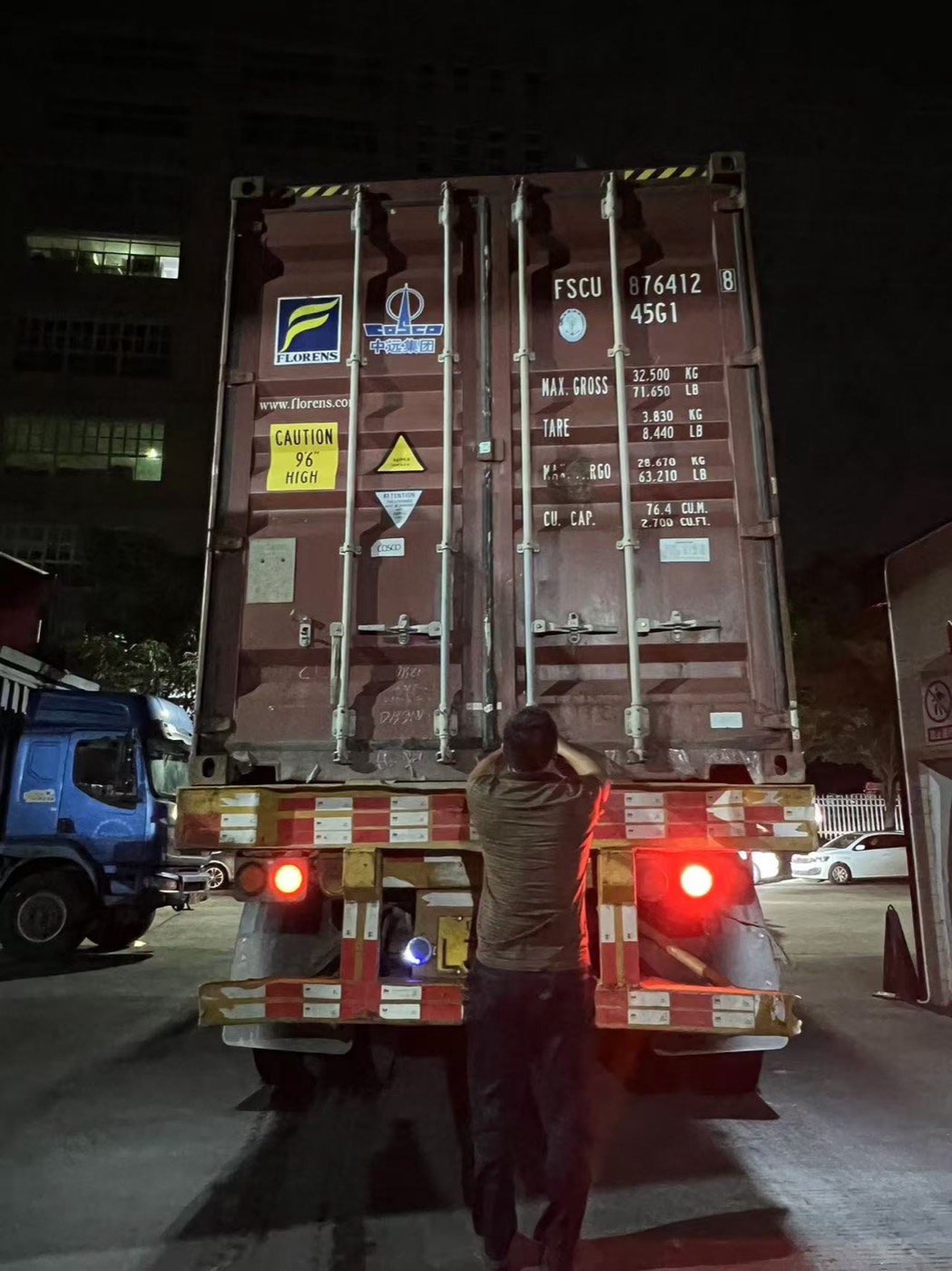 Container being loaded at night at the supplier's dock