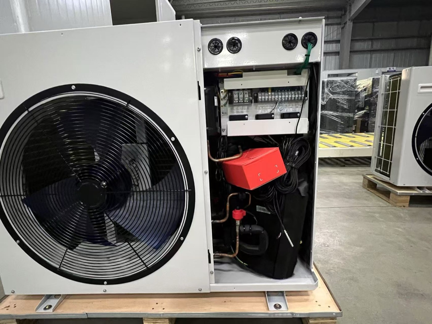 Heat pump unit with its service panel open for inspection
