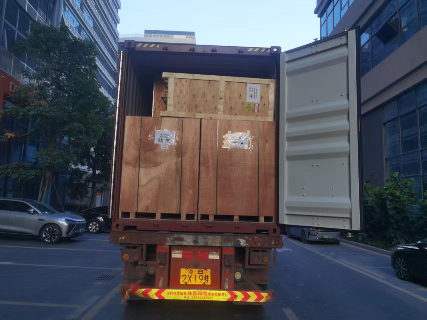 Crated cargo being loaded into a container