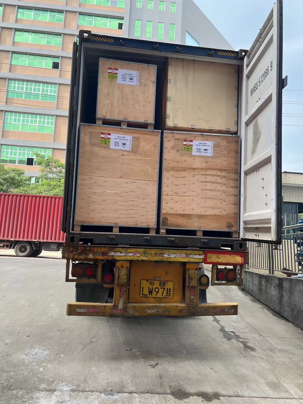 Wooden crates secured inside an open container