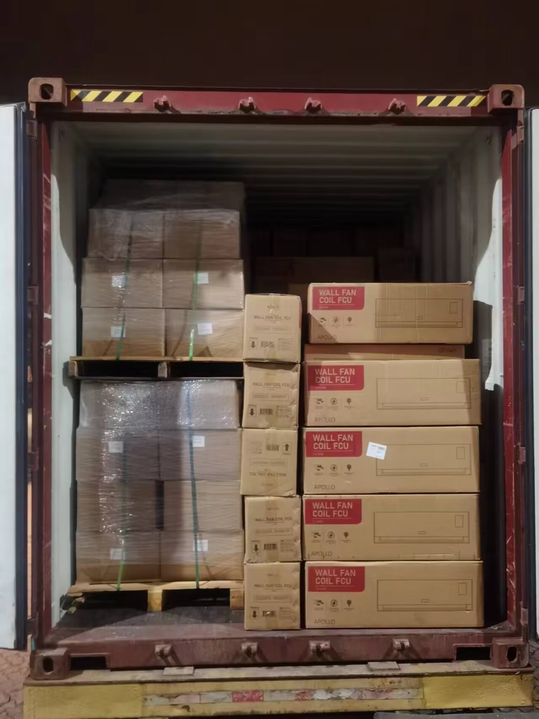 Mixed cartons and crates loaded in a red container