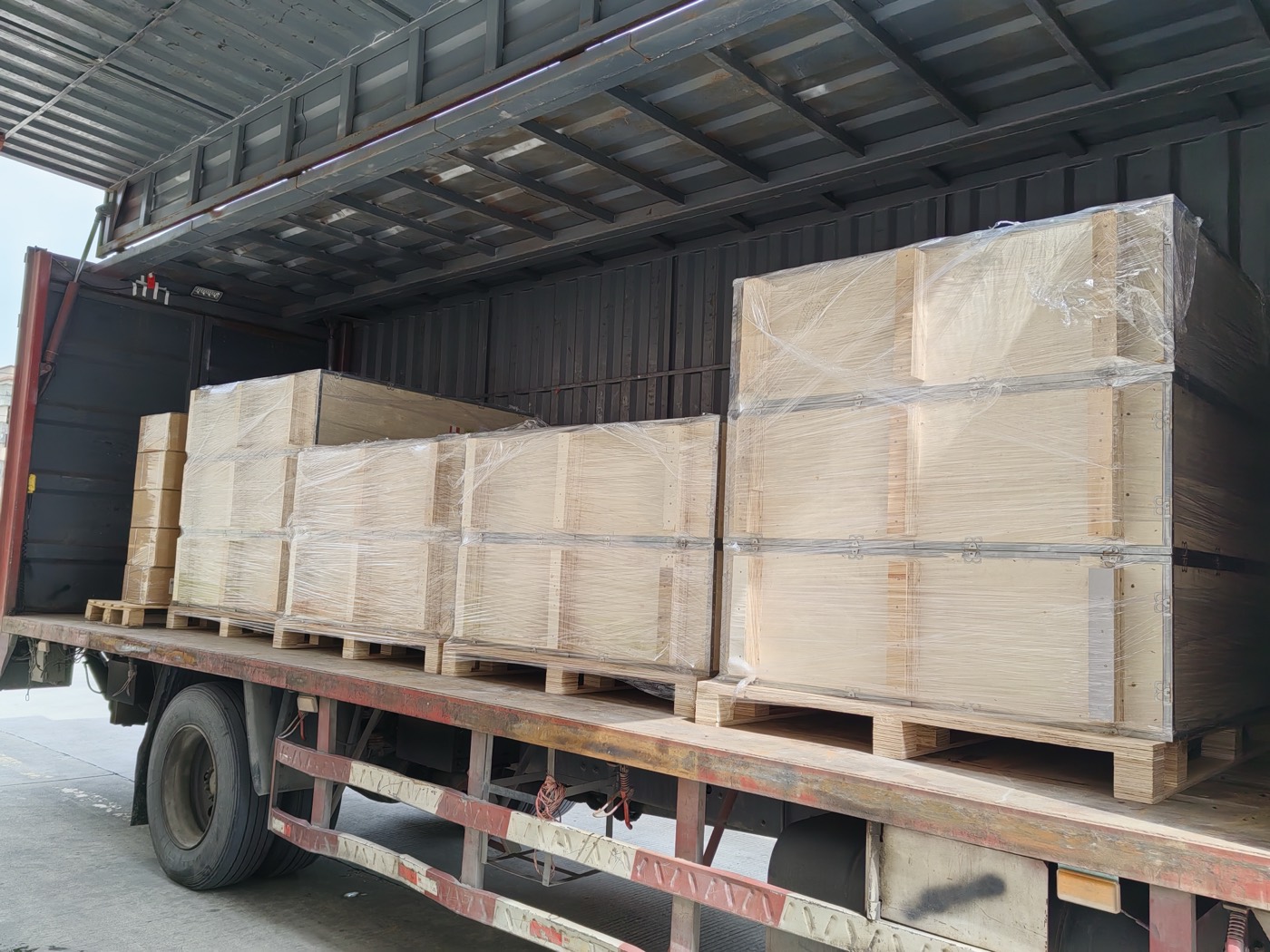 Crates lined up on a flatbed trailer